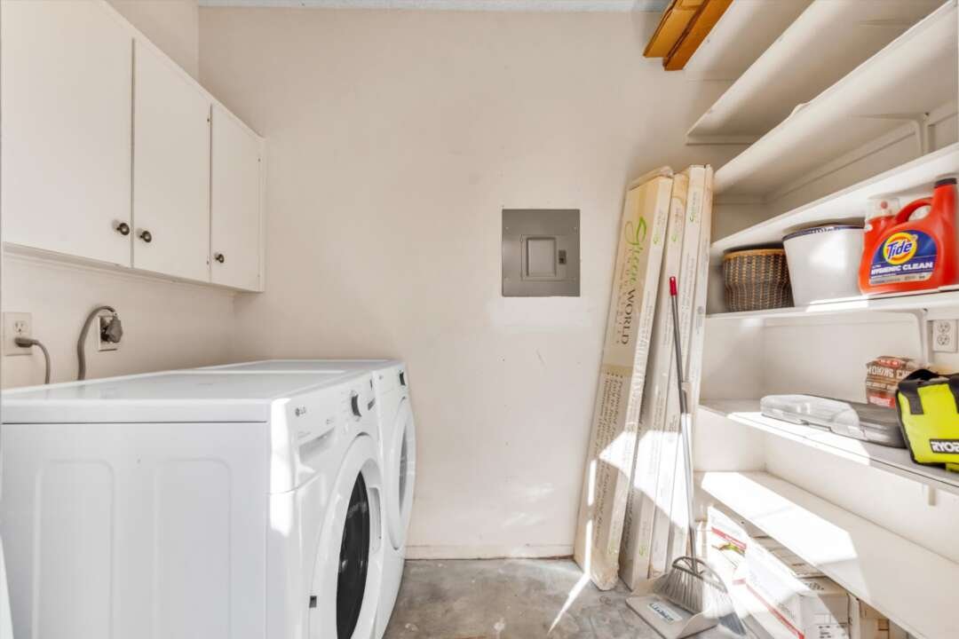 In-unit laundry room in private patio storage