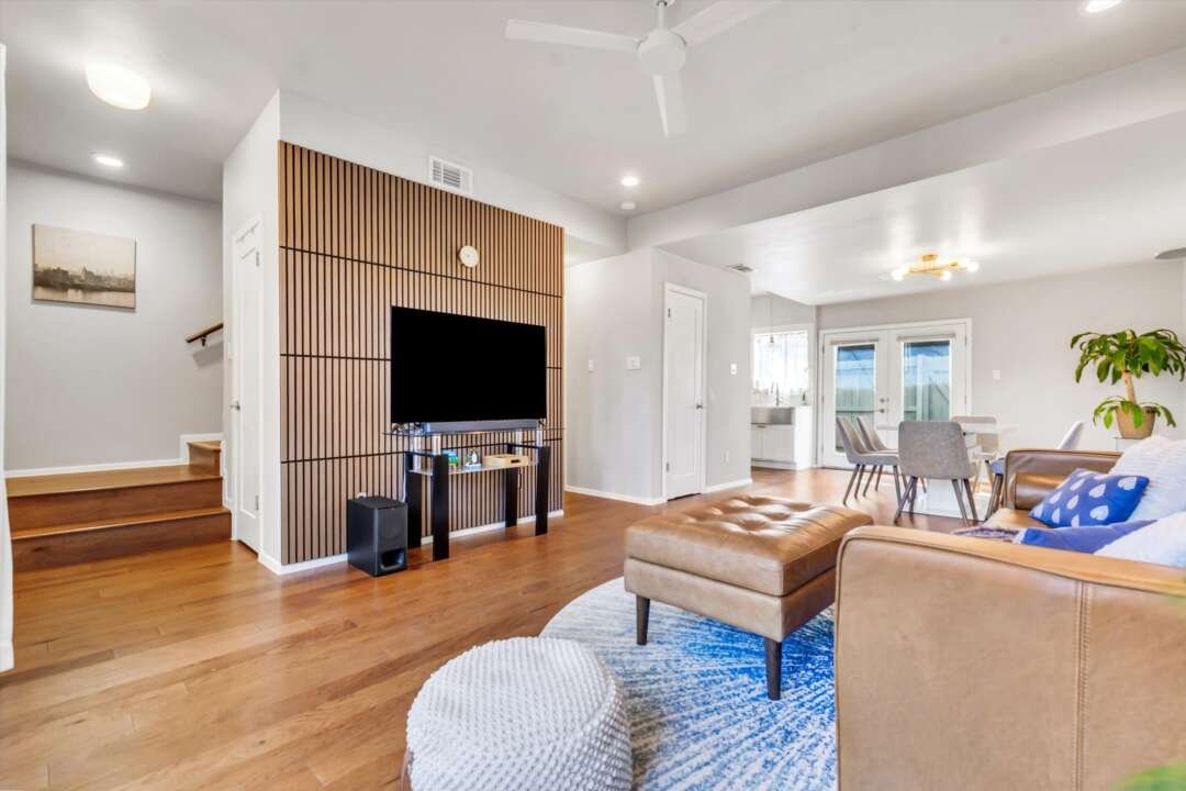 Living room with wood slat feature wall