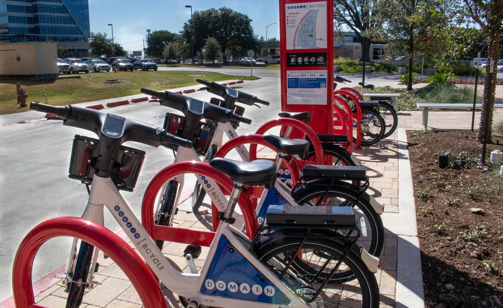 Bikeshare bikes at The Domain in North Austin, reflecting the area's walkable, bike-friendly design