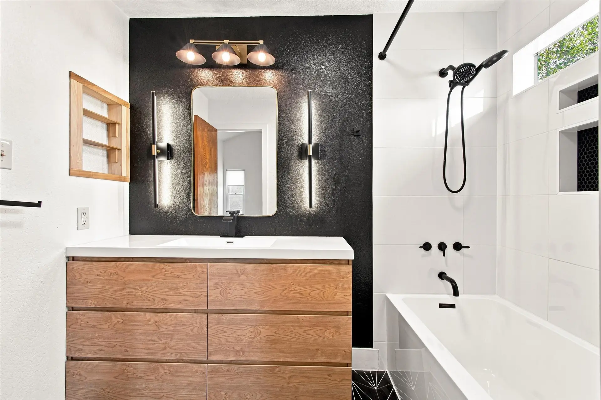Primary bathroom with vanity and matte black fixtures