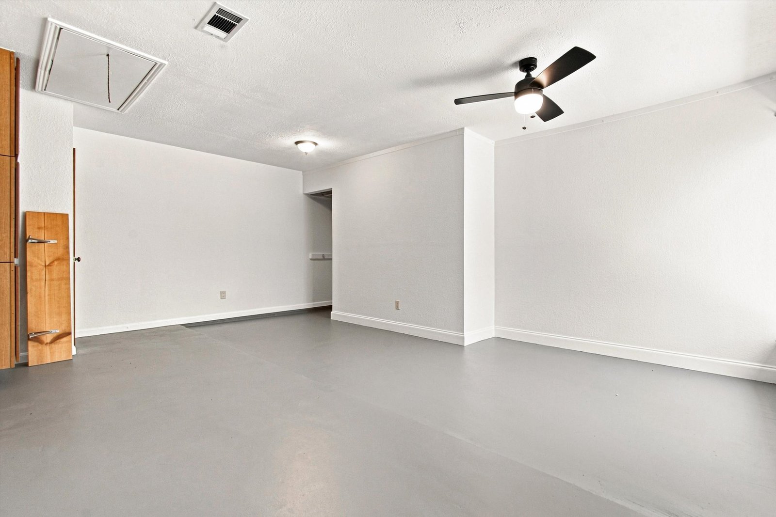 Bonus room flexible open space with painted concrete floors