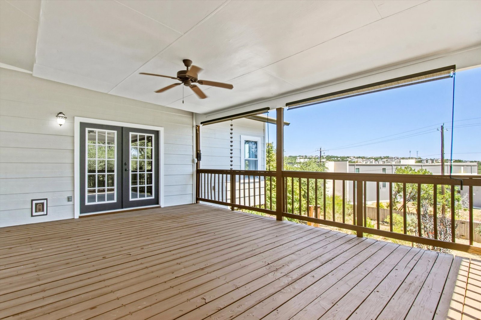 Covered deck and walkway with landscaped grounds